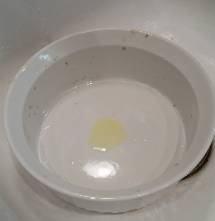 The amount of detergent to use depends on the number of dishes being washed and how greasy they are. You don't want too many suds as that makes it harder to rinse the dishes once they are clean. Next, fill the vessel with hot water.