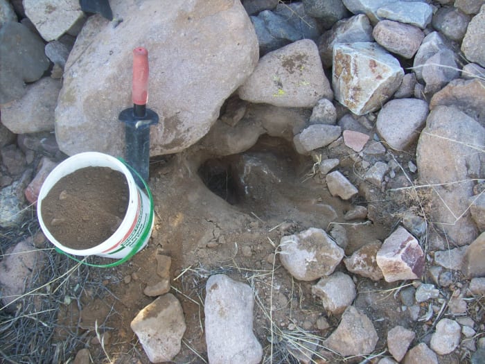 I like to use a Minelab trowel because it won't bend and it has a serrated side to saw through roots. Ad old mud bucket is the right size for sampling. If you dig, fill the holes.