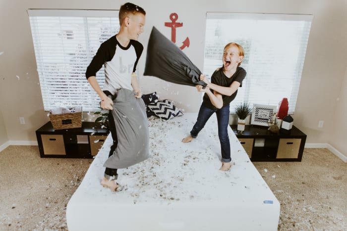 When it's too hot or too cold to play outside I have my kids jump on my king sized bed to pop music streamed through Spotify. It helps burn off some serious energy and if we do it in the middle of the day, most neighbors are at work or at least awake