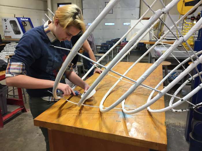 This high school student at the Governor's Academy for Engineering Studies is lending her engineering creativity to a rival high school's theater project.