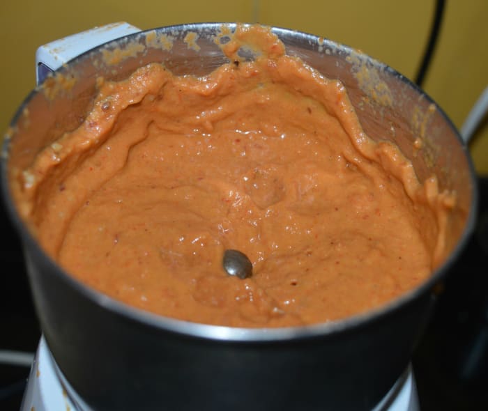 Once it becomes completely cool, add salt. Grind, adding water, to get a smooth paste. Transfer it to a serving bowl.