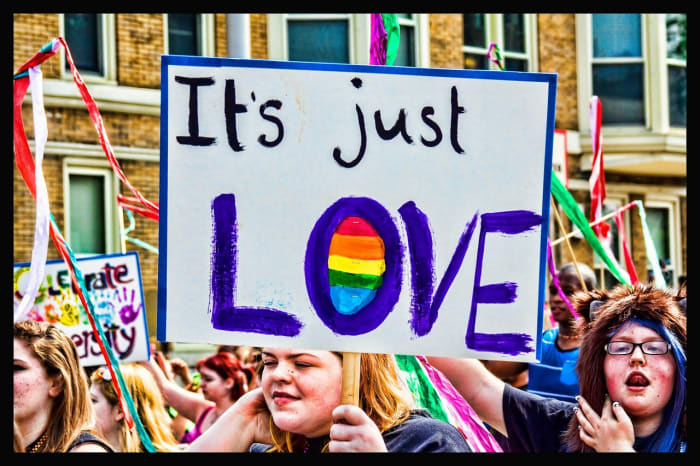 Don't turn your friend's homophobia into a political issue--you're just blowing it up to a level that it doesn't deserve.