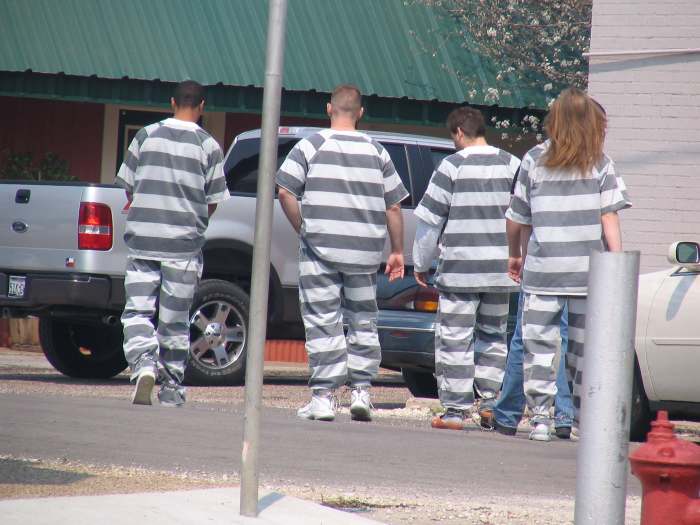 Modern chain gangs are called work groups. They don't wear chains and work under close supervision of a guard picking up trash or performing other work of community benefit.