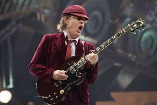 Angus Young with one of his custom made SGs, you can see this from the lightening bolt inlays on the fretboard.