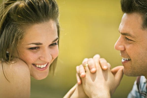 Guys love it when a girl laughs, smiles or blushes. Anything that gives him a clue she's noticed him!