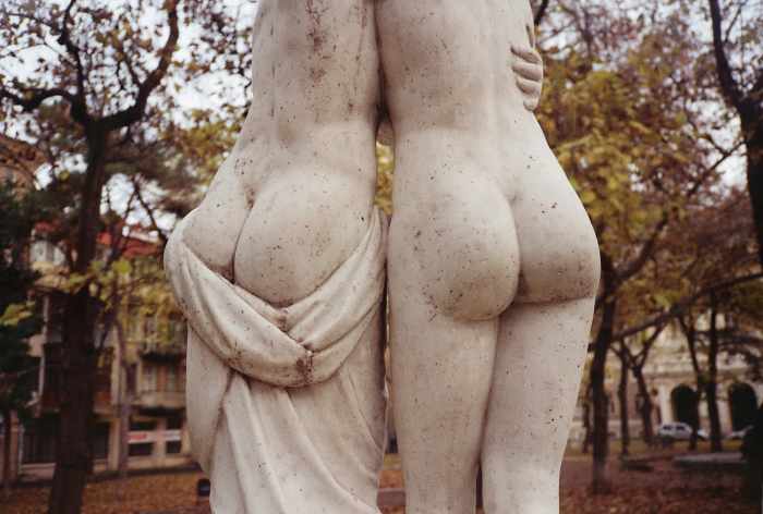 Why are statues always unclothed? Give these gals a cover up. They're obviously huddling from the cold.
