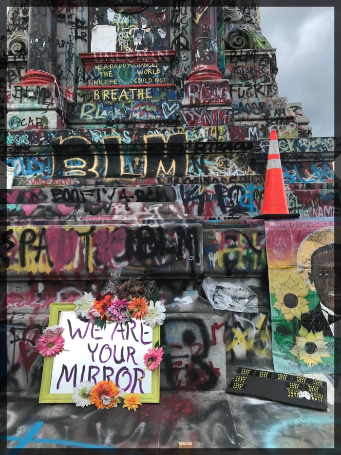 This statue of Confederate Gen. Robert E. Lee was removed during the time of the Black Lives Matter demonstrations in 2020. Protesters repainted its base with messages.
