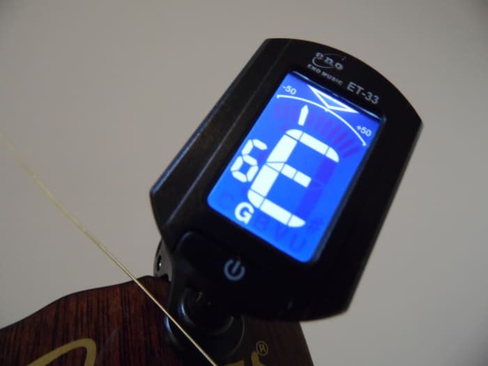 How to Tune a Guitar With a Tuner Spinditty Music