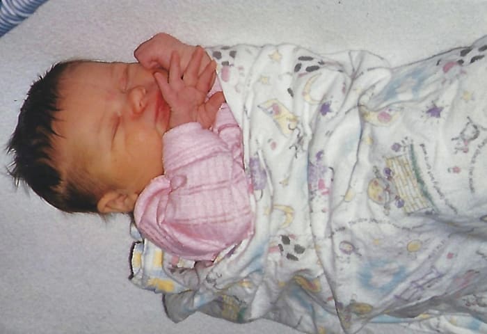 Here was my newborn baby, many years ago. She's now taller than me and old enough to have kids of her own, but she'll always be my baby.