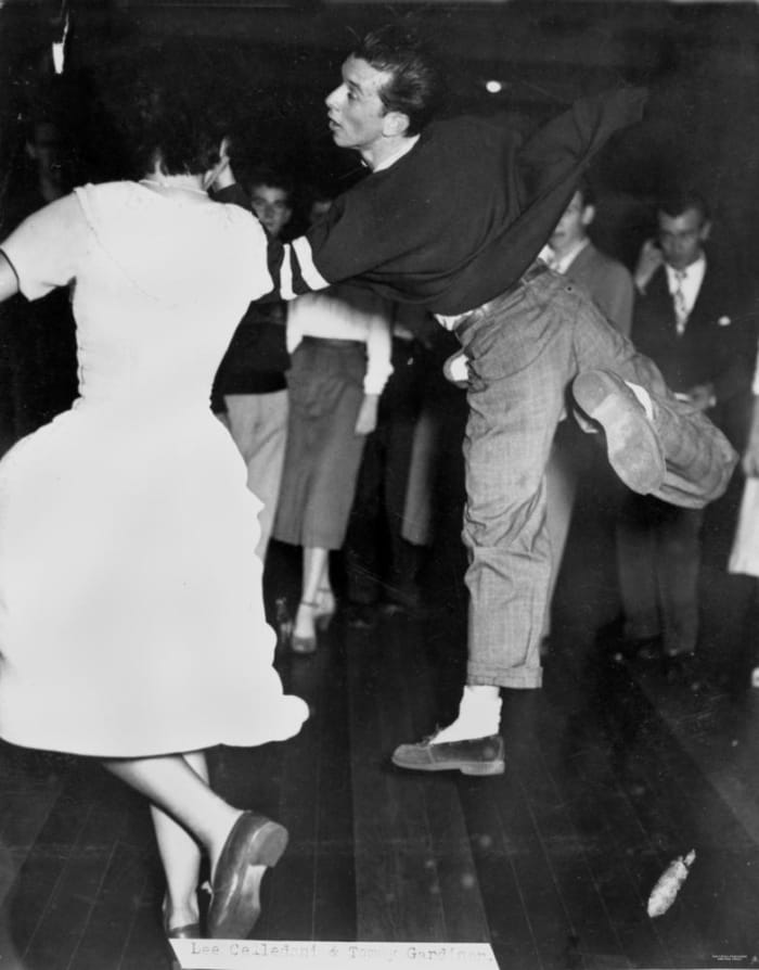This fella is very light on his feet at this 1950 school dance.