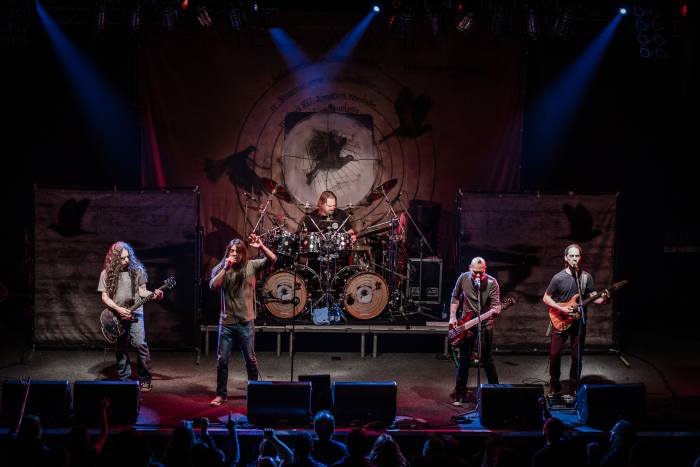 Most metal bands are five pieces with drums, lead guitar, rhythm guitar, bass, and vocals.