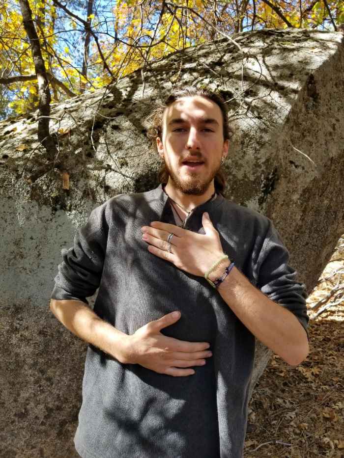 Student, Singer/Actor "Wren" demonstrates how to keep the chest quiet while inflating from the abdomen for proper breath support.