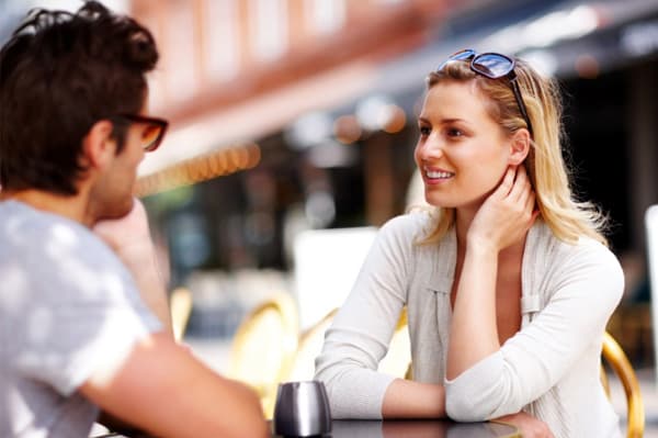 Watch her body language to tell if a girl likes you. Touching her neck or hair could be an unconscious sign that she likes you.