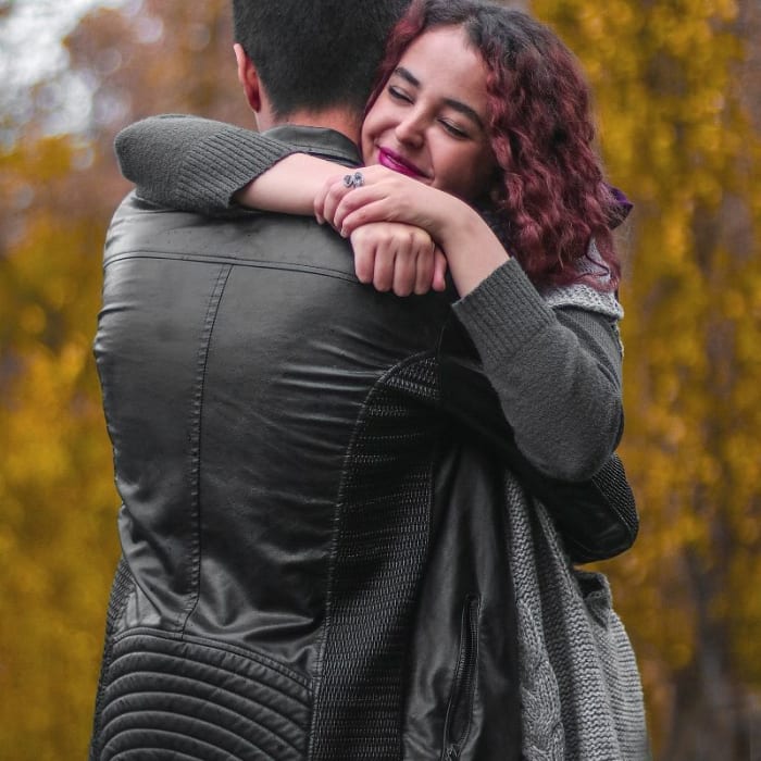 If you remain confident as you approach the girl you're hugging, she will be relaxed, and the situation won't be awkward.