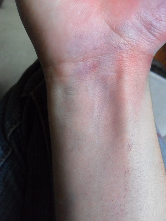After adding blending some red into my base layer, my wrist now shows a spotty mix of purple, red, and blue.