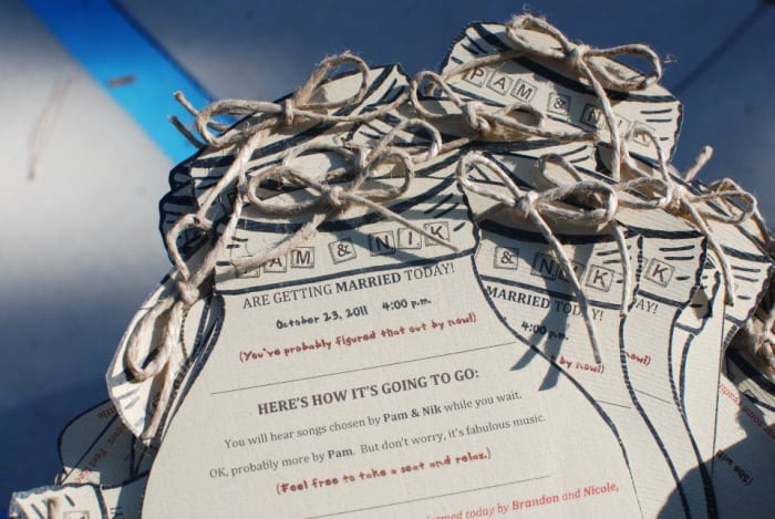 Mason jar-shaped programs from scrapbook paper.