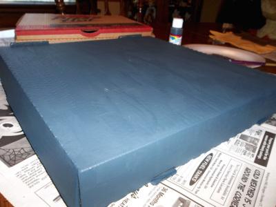 If you have time, coat the pizza box twice so that any images printed on it don't show through in the finished craft.