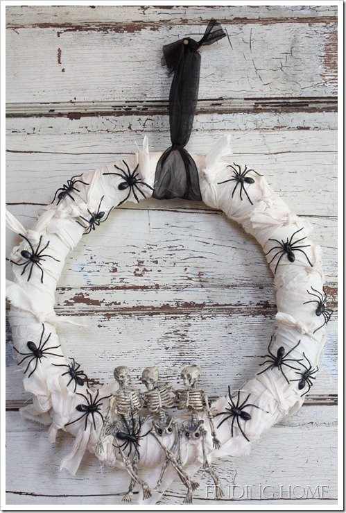 This mummified wreath was done using a muslin type fabric that was torn by hand to get the rough edges. Again, special effects were added using plastic spiders and skeletons.
