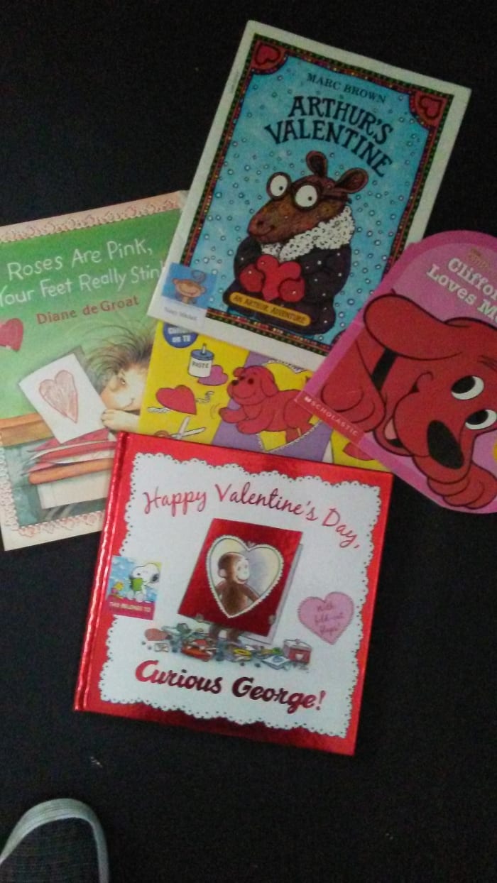 Go to the library or book store to get Valentine's Day books. Clifford, Arthur, and Franklin are favorites. Reading Valentine's day books Is the best way to learn about the holiday.