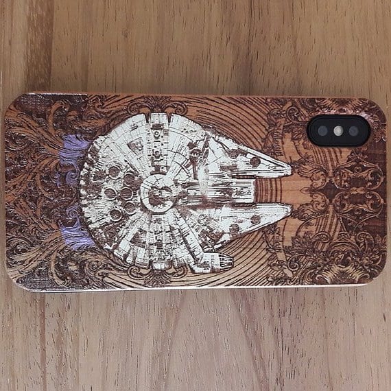 The Engravers Dungeon on Etsy does beautiful work. They have tons of different wood phone covers and they make posters from woodcuts, too.