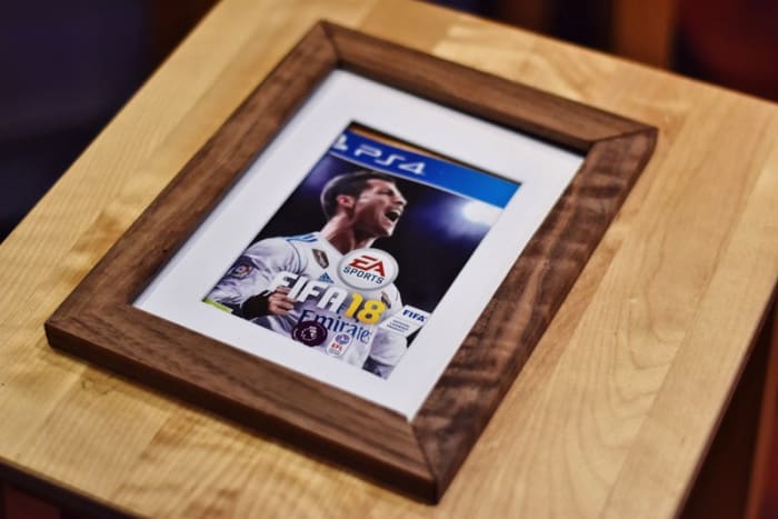 Even if you don't have the perfect photo on-hand, you can still frame something meaningful. Think a favorite t-shirt that no longer fits, an album cover, or even a pair of tickets from an event you attended together.