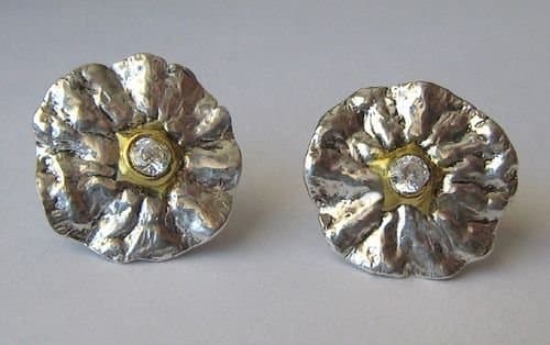 Fine silver metal clay earrings molded from the blossom end of a tangerine, embellished with gold and set with clear round CZ gemstones.