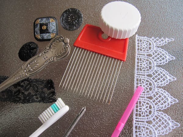 Examples of common household items and found objects used to texture clay.