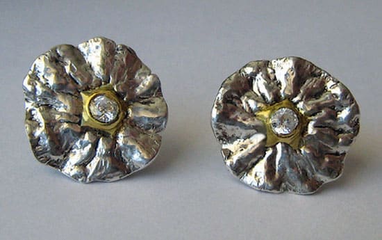 Fine silver, 22k gold and cubic zirconia earrings molded from the stem end of a tangerine