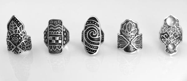 Sterling silver shield rings by Wanaree Tanner. PMC Sterling silver clay textured with original designs hand-embossed into Scratch-Foam. used by permission of the artist;