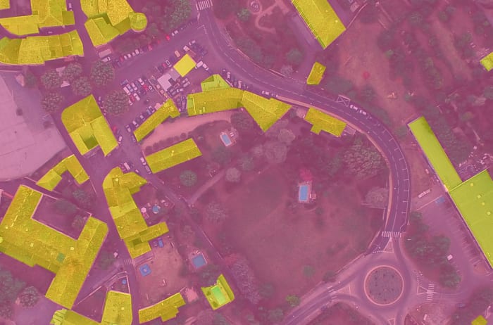 Image classification techniques were also used to find buildings in this image. It's not perfect but I'd say it's pretty good.