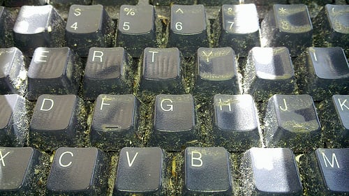 Dirt can easily hide between the keys on keyboards, so clean your keys carefully. CC BY-2.0, via Flickr.