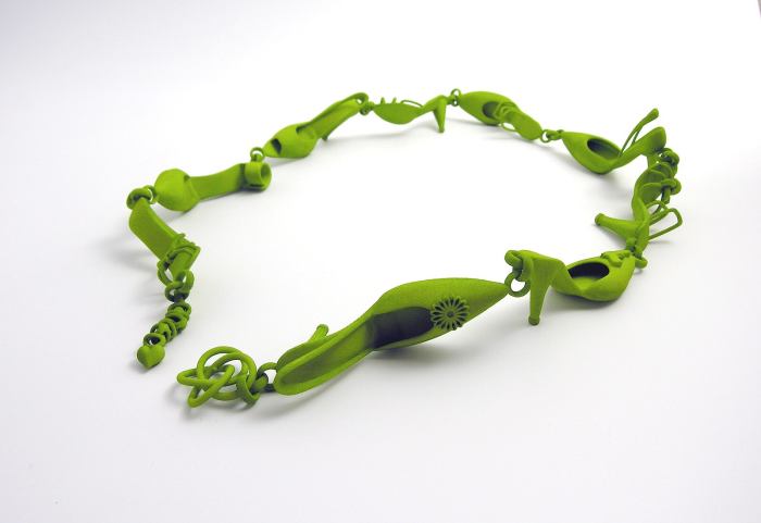 This 3D printed bracelet is composed of shoes and created by a jewelry designer. It may have been created by a more advanced printer than a consumer-oriented one.