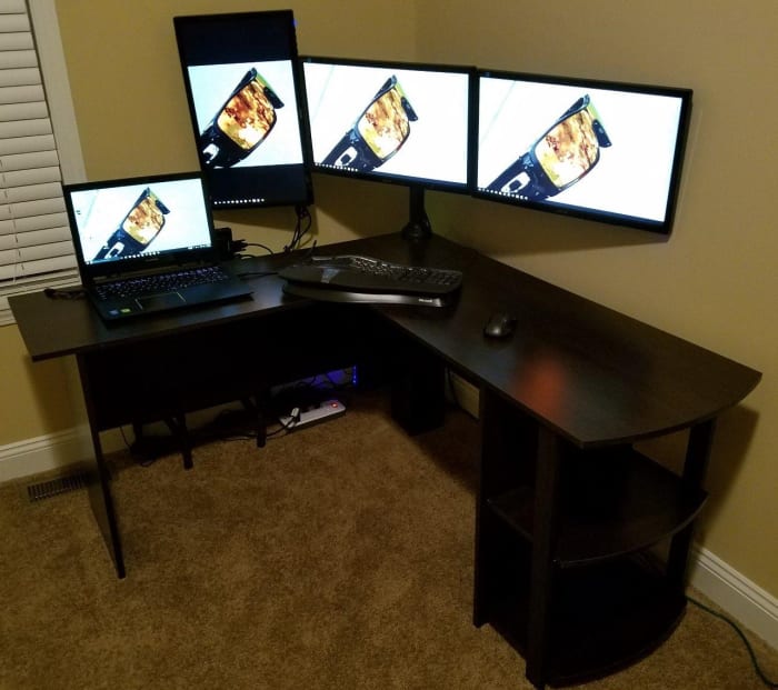 The Ameriwood Home Dakota L-Shaped desk comes in at under $75. It's sturdy, has plenty of room, and several styles to choose from.