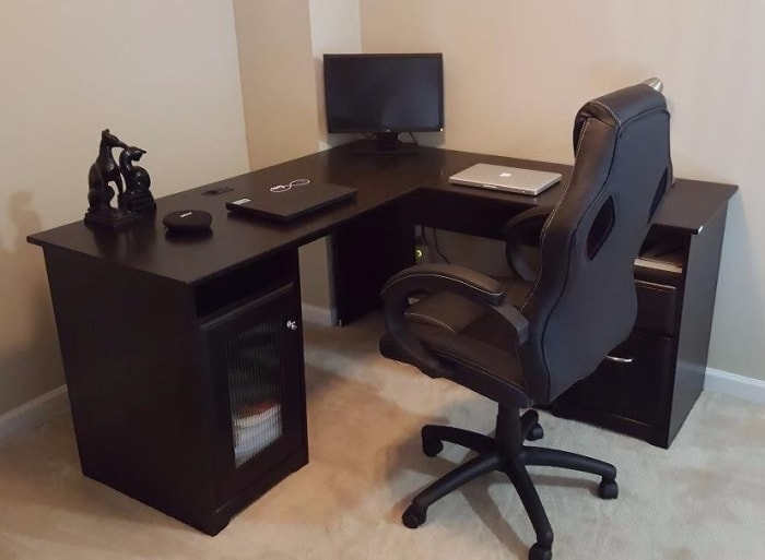 For a large desk under $250 I like the Cabot Collection 60" L-Desk. It comes in three different finishes, has a 4-port USB hub, and is solid.