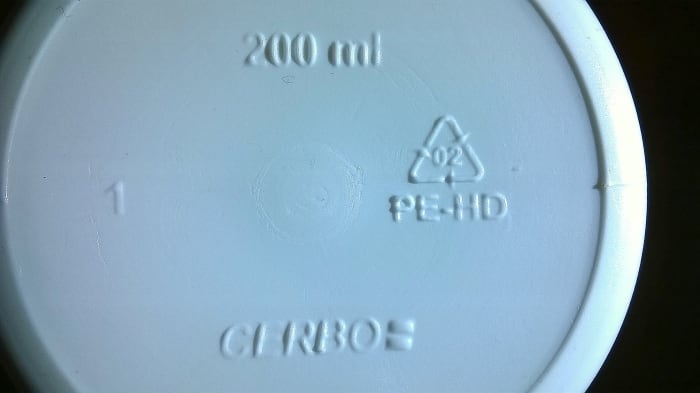 Plastic recycling/identification code embossed onto the underside of a medicine bottle