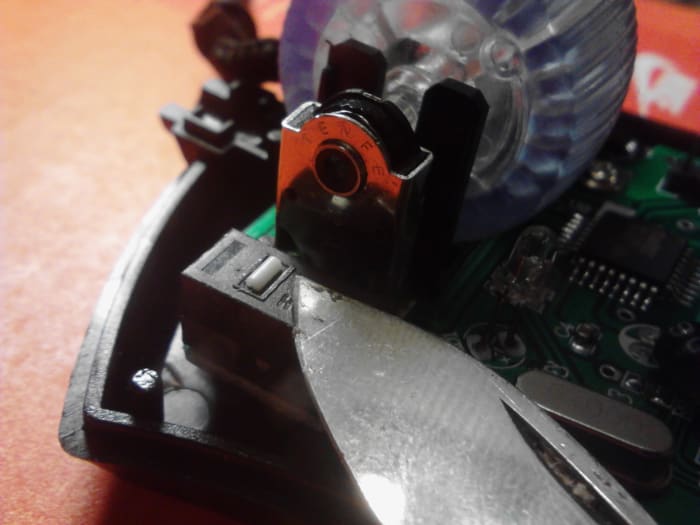 Carefully replace the switch cover. Use care when replacing the small white portion of the button. This is easy to lose. Gently snap the cover evenly back on top of the switch. Trim or adjust the memory foam if you are having trouble.