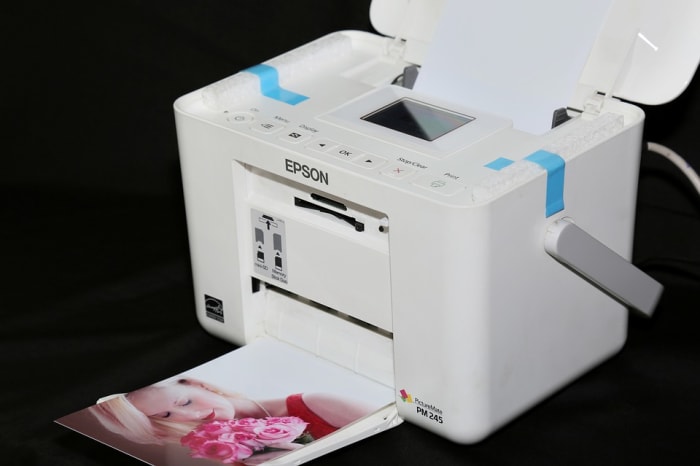 Film photographers had to use either a commercial business, or a darkroom to develop photos. Digital technology enables users to simply print out photos at home.