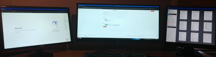 HubPages is open on the main screen. Grammarly is open on the second screen. LibreOffice is open on the fourth screen.