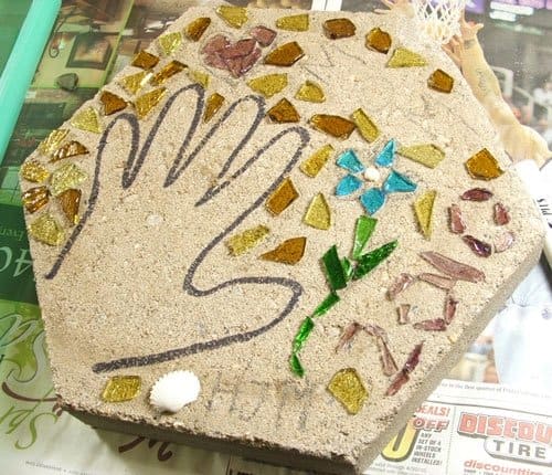 Step 2. Set up your work-space to include plenty of room to place your pre-laid design next to the precast stepping stone. After pouring your mortar slurry you will need to transfer your design pieces quickly before the mortar dries.
