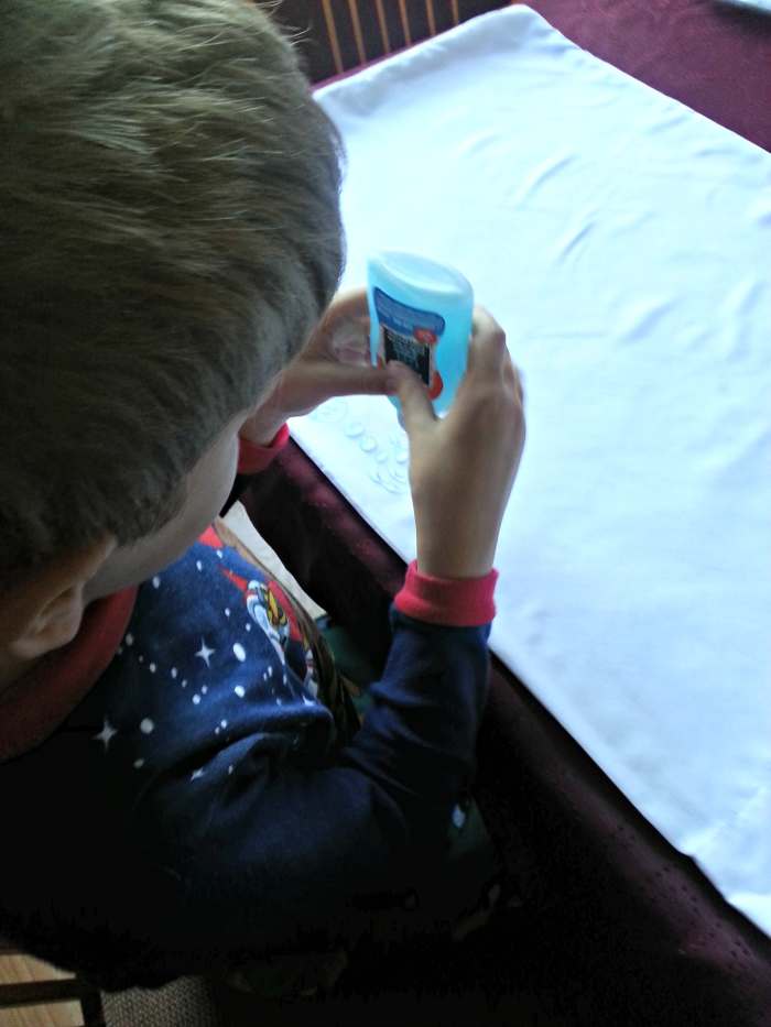 Start the process by letting your little ones "draw" on the fabric with glue. They can create whatever their imaginations can conjure up.