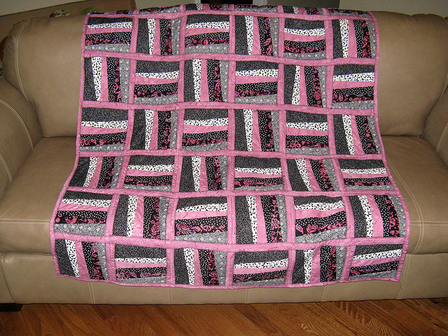 Although not exactly like the quilt she is describing, this quilt gives you an example of stripped pieces laid horizontally and then vertically.