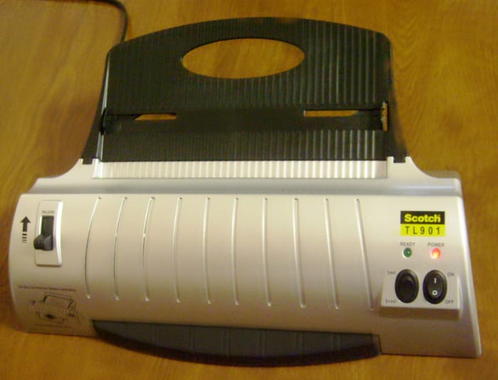 You can use laminating sheets with a machine such as this or choose manual laminating sheets which are sticky on the inside and require a bit more patience.