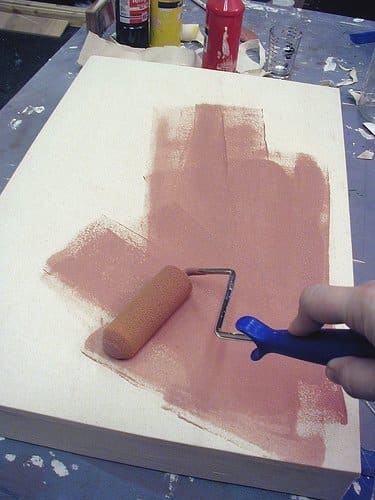 A colored gesso application creates a tinted ground. You can brush the gesso on or use a roller.