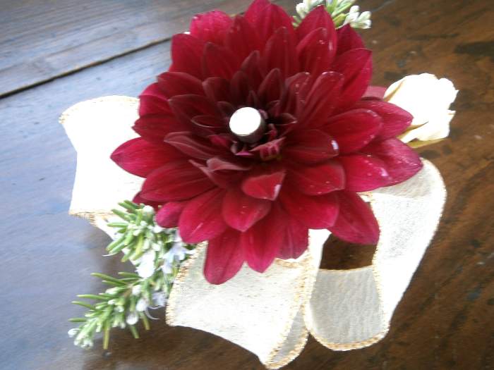 Brian's boutonniere--a single wine-colored dahlia, small white roses and sprigs of rosemary.