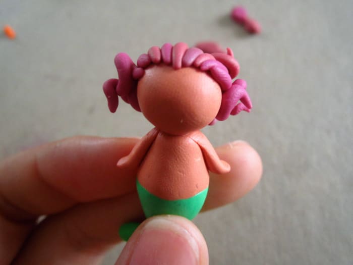 I messed up this one's hairline a bit--it seems she has a widows peek! To try to avoid doing that I did mark off the hairline very gently with some wire.