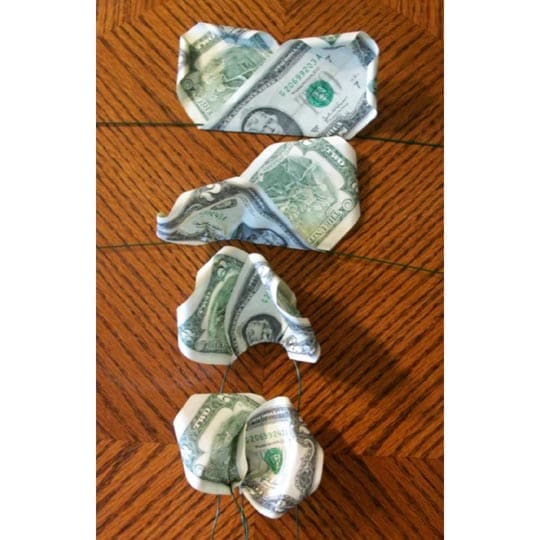 Step #4: Take your time and be patient putting the money onto wires to avoid damaging the bills.