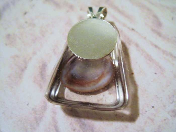 No drill? You can use a glue on bail like this one. Glue the bail to the back of the pendant with superglue.