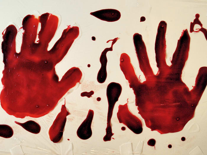Press your bloody hand into the bases and then drop whatever remaining glue is left to create blood drops.