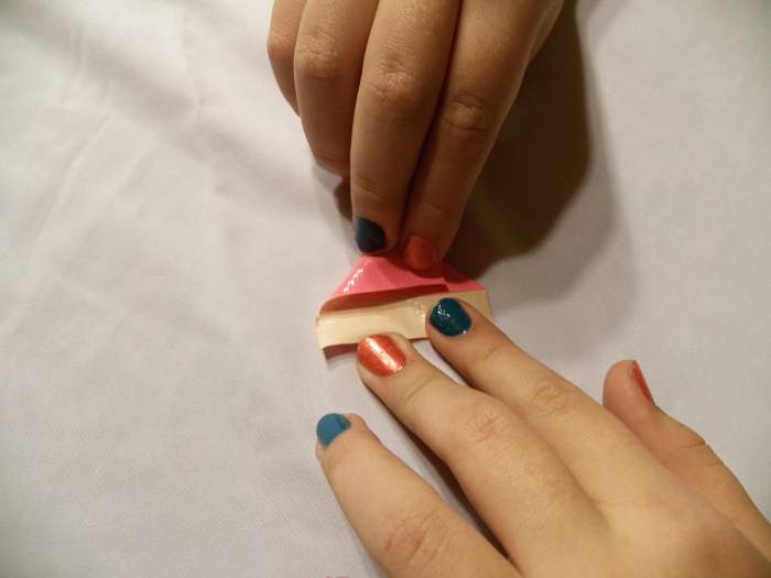 Step 3: Fold left corner down until the side meets the first fold.