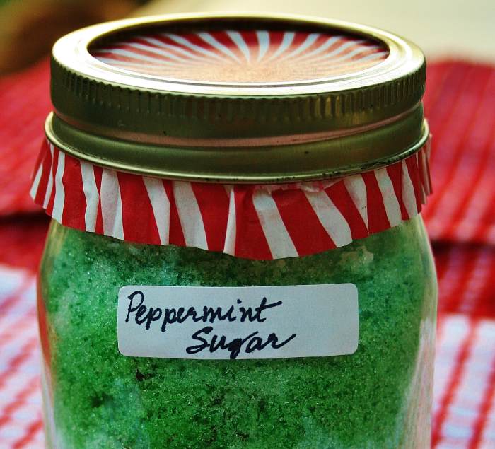 A few tablespoons of colored sugar & a cupcake liner add fun color to a jar of herbal sugar.